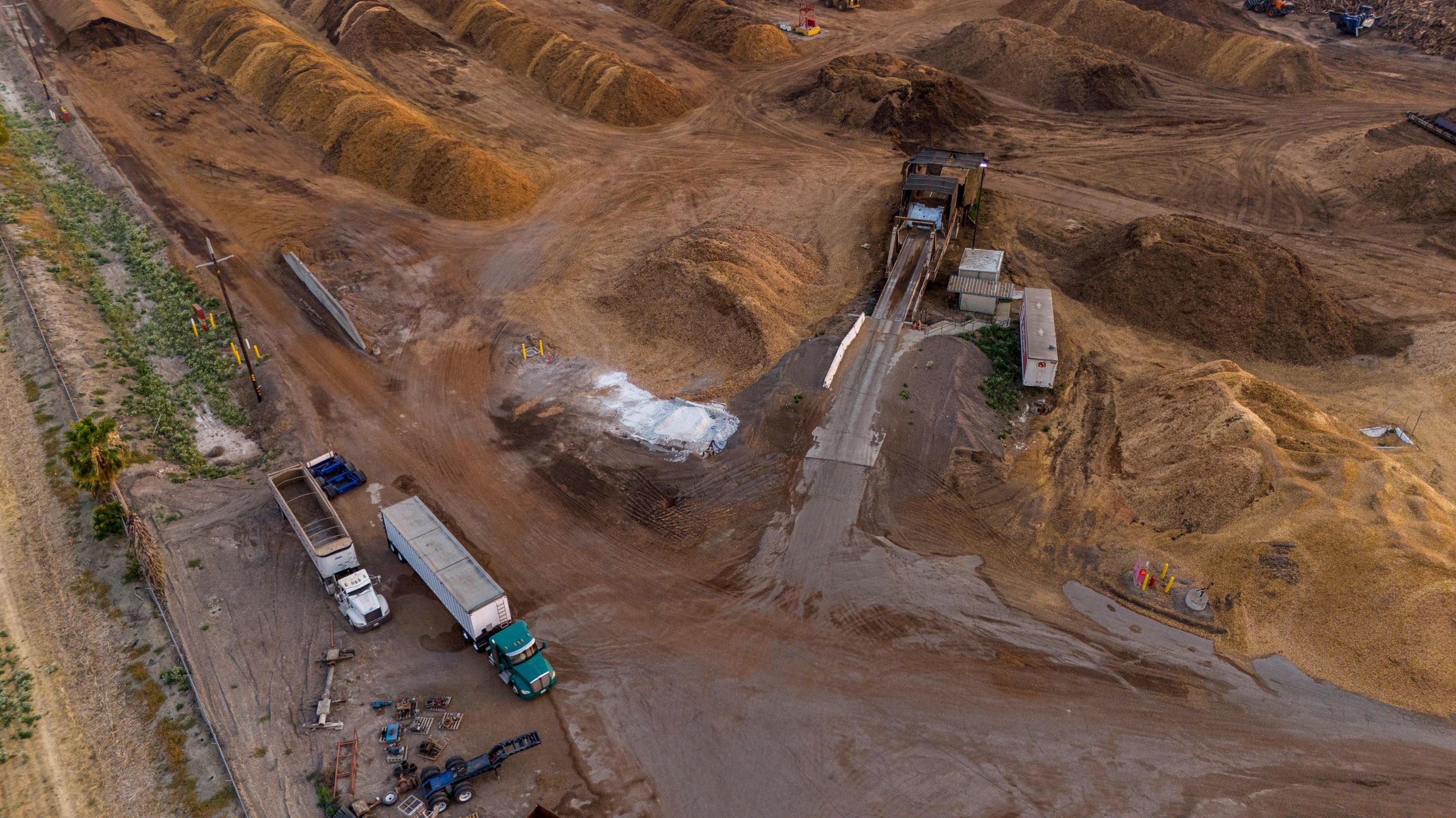 Large-scale recycling facility with material handling equipment